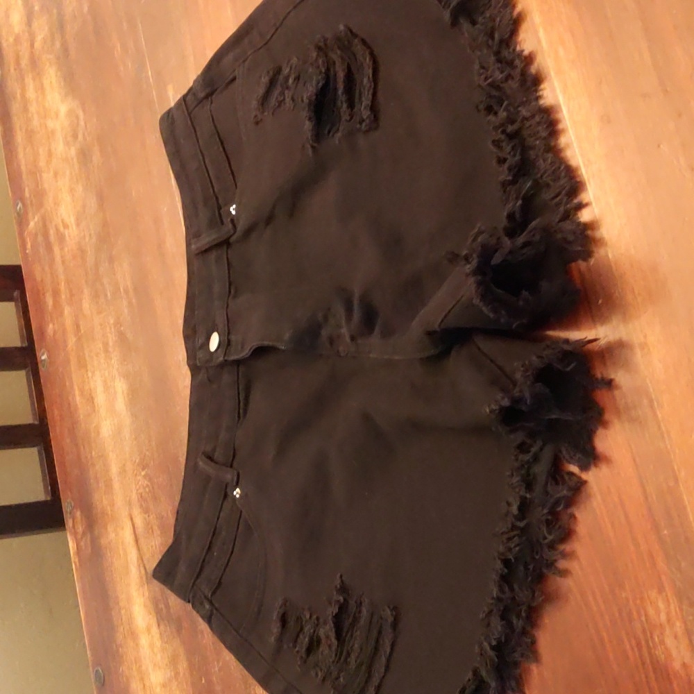 Black denim distressed shorts.